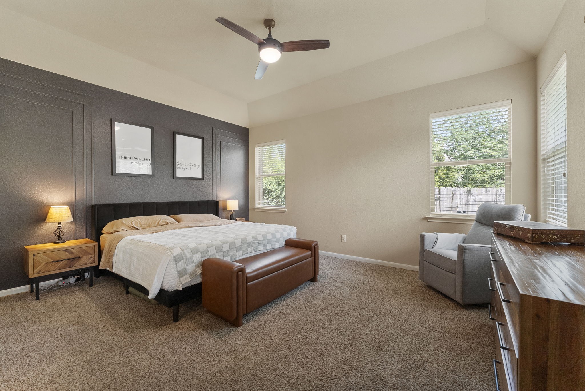 174 Maple Grove Drive Conroe, TX 77384 - Photo 11 of 26 A large and private primary suite complete with a stylish accent wall — a true retreat at the end of the day.