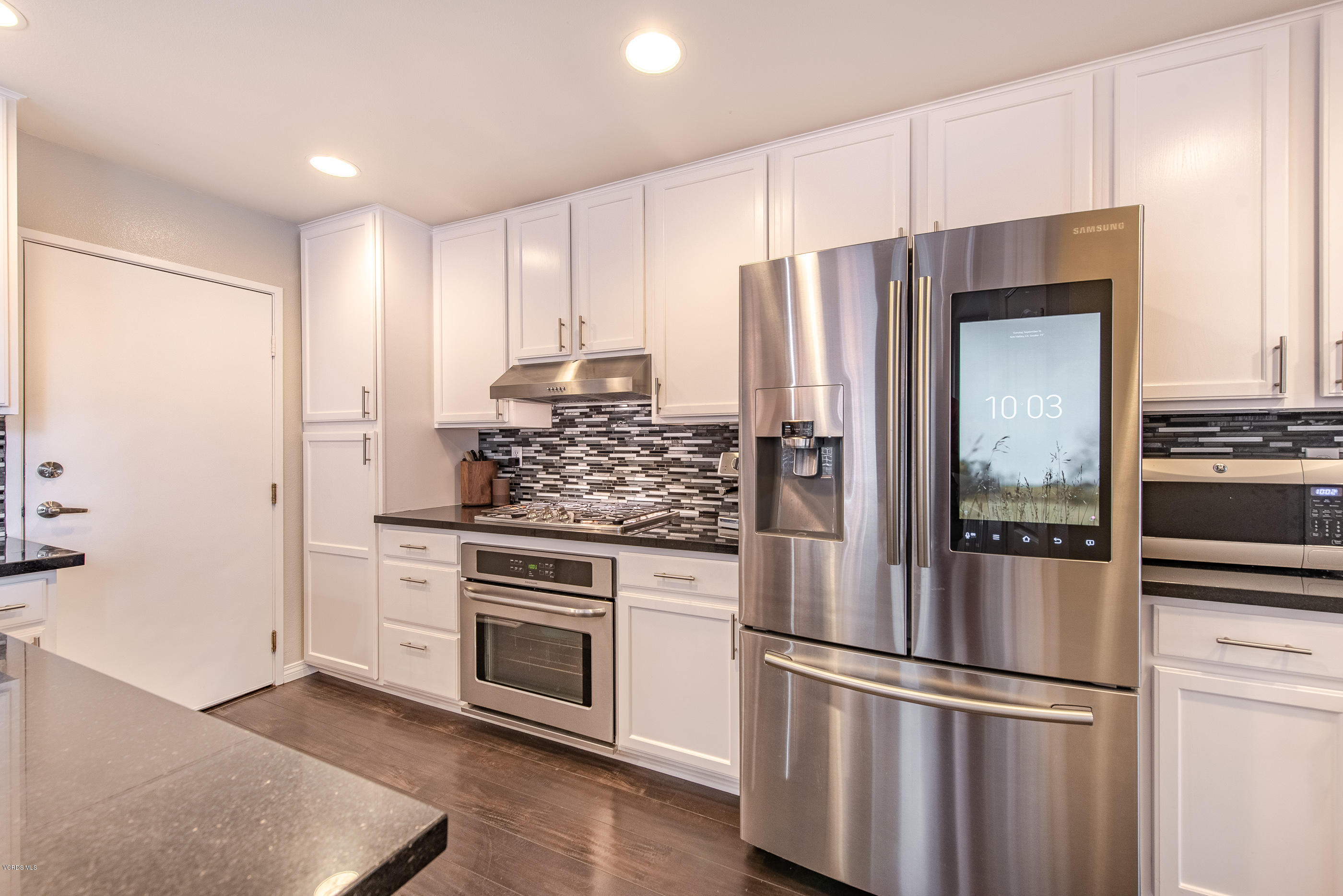 308 Hedge Row Lane, Unit B Simi Valley, CA 93065 - Photo 11 of 27 a kitchen with stainless steel appliances a refrigerator stove and sink