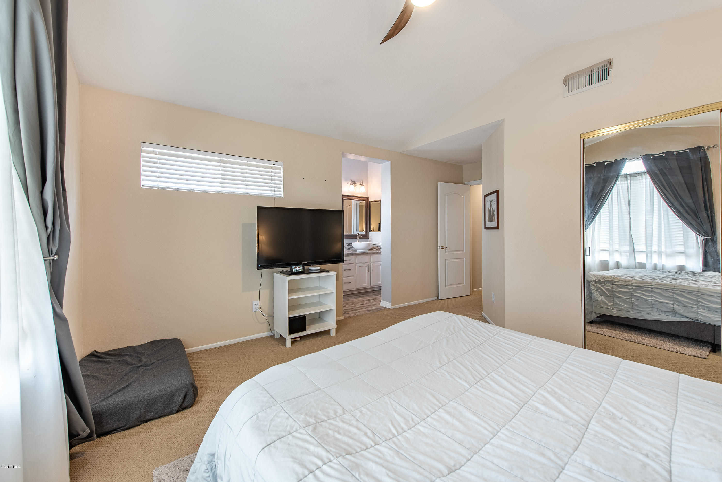 308 Hedge Row Lane, Unit B Simi Valley, CA 93065 - Photo 18 of 27 a bedroom with a bed and a flat screen tv