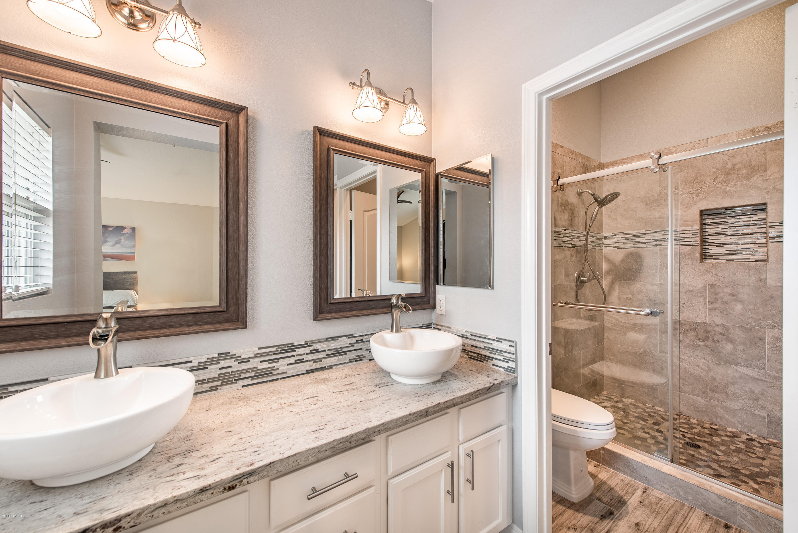 308 Hedge Row Lane, Unit B Simi Valley, CA 93065 - Photo 19 of 27 a bathroom with a granite countertop sink toilet a large mirror and shower