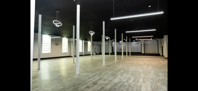 a view of a gallery with wooden floor