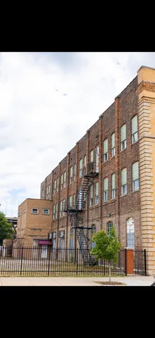 a black and white building with a view of city