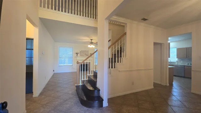 a view of entryway and hall with a dining room