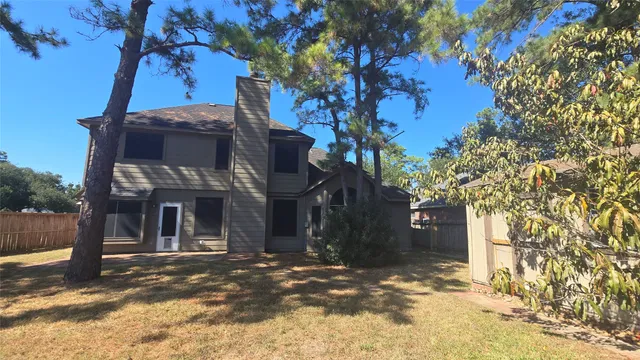 a view of a house with a tree