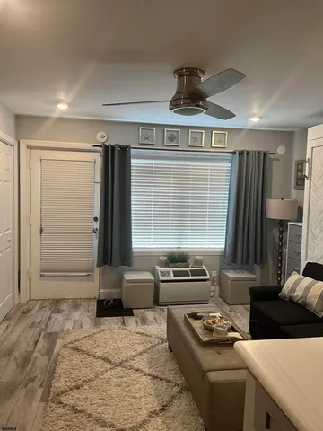 a kitchen with a stove a refrigerator and a sink