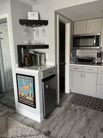 a kitchen with stainless steel appliances granite countertop a stove and a microwave