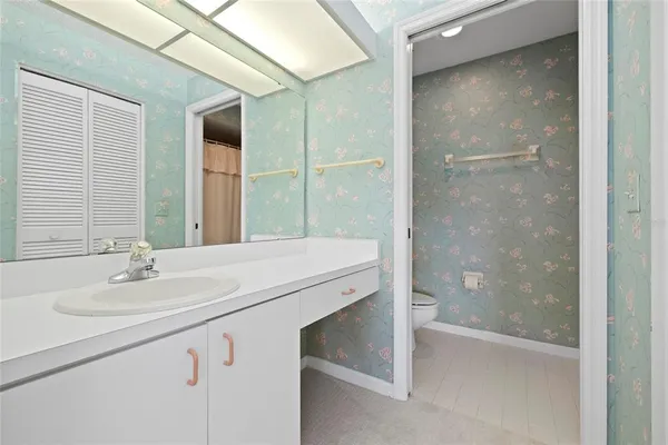 a view of a swimming pool with an outdoor space and seating area