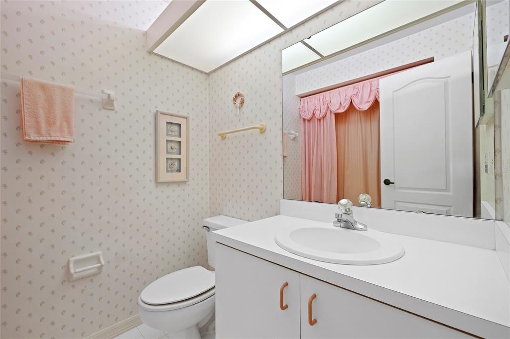 6507 Stone River Road, Unit 304 Bradenton, FL 34203 - Photo 20 of 51 a bathroom with a sink toilet and a mirror