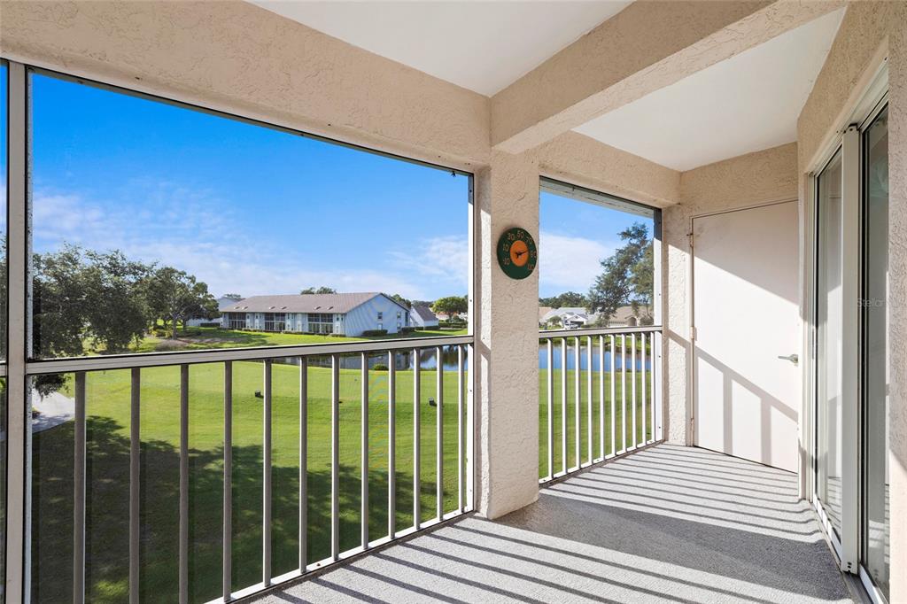 6507 Stone River Road, Unit 304 Bradenton, FL 34203 - Photo 26 of 51 a view of a balcony with wooden floor