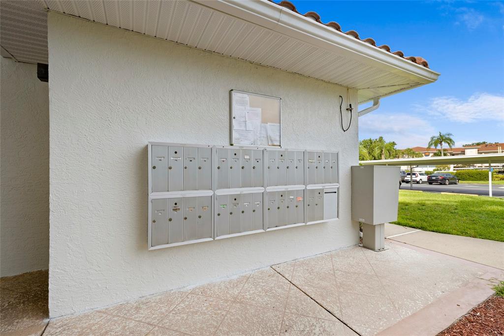 6507 Stone River Road, Unit 304 Bradenton, FL 34203 - Photo 28 of 51 a view of a wooden house with a yard
