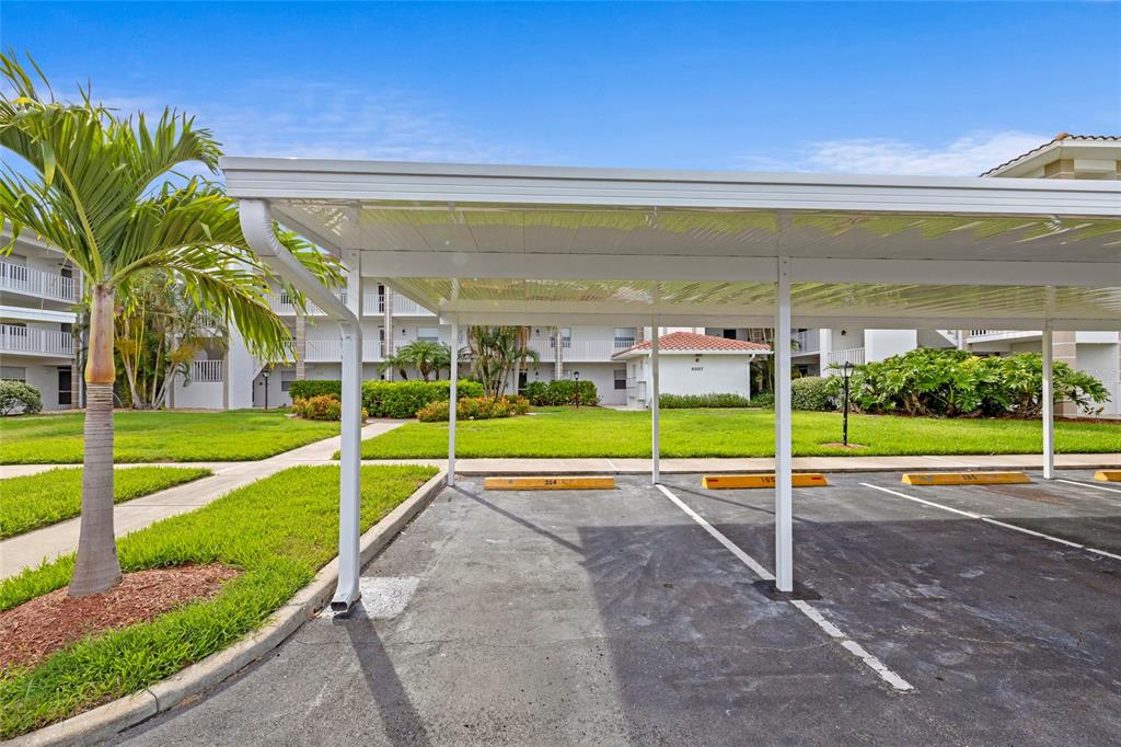 6507 Stone River Road, Unit 304 Bradenton, FL 34203 - Photo 29 of 51 a view of a swimming pool with an outdoor space and seating area