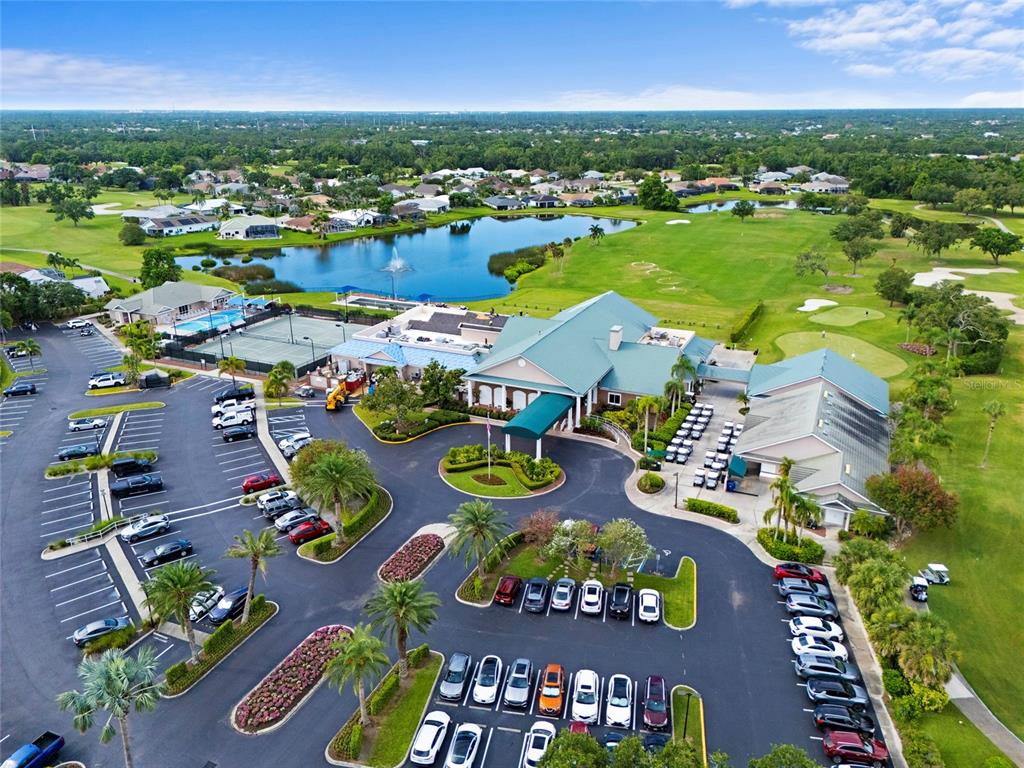 6507 Stone River Road, Unit 304 Bradenton, FL 34203 - Photo 30 of 51 an aerial view of residential houses with outdoor space