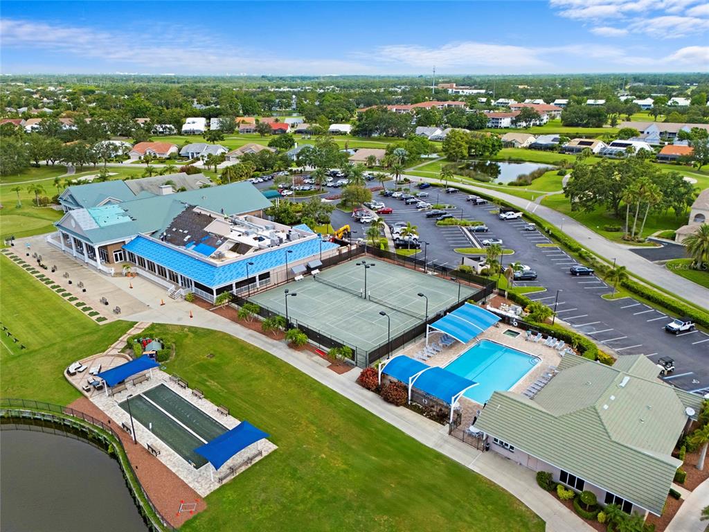 6507 Stone River Road, Unit 304 Bradenton, FL 34203 - Photo 32 of 51 an aerial view of residential houses with outdoor space