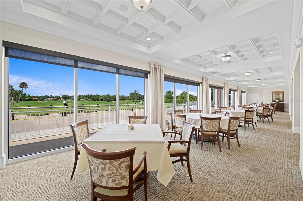 6507 Stone River Road, Unit 304 Bradenton, FL 34203 - Photo 42 of 51 a view of a dining room with furniture window and outside view