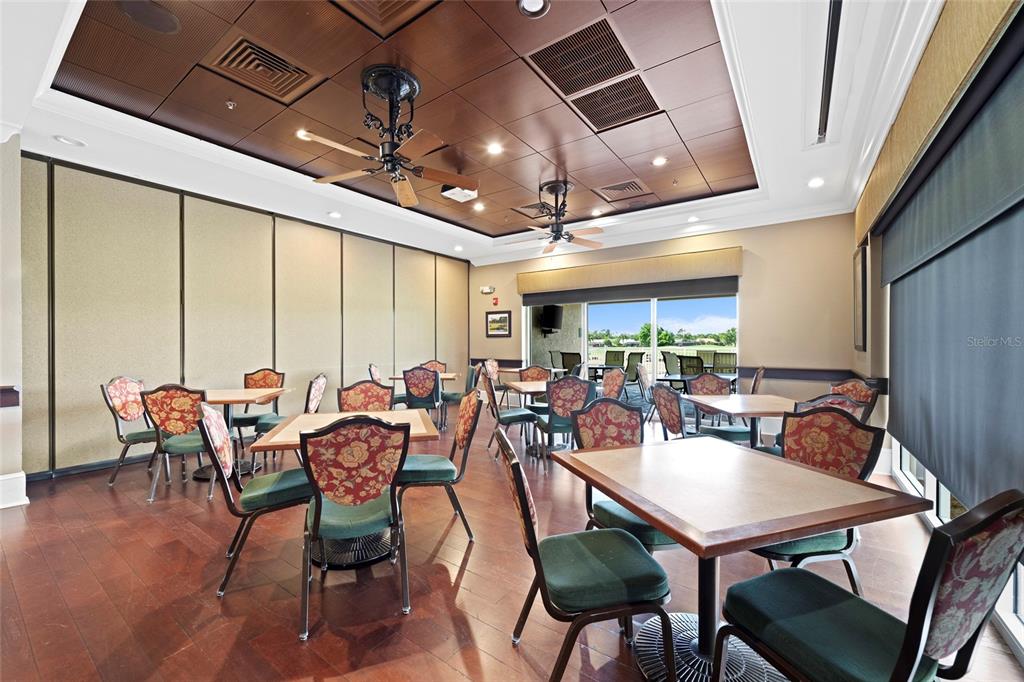 6507 Stone River Road, Unit 304 Bradenton, FL 34203 - Photo 44 of 51 a view of a dining room with furniture window and outside view