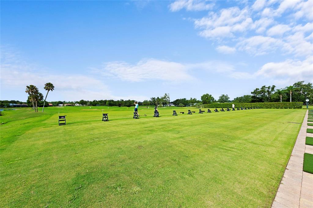 6507 Stone River Road, Unit 304 Bradenton, FL 34203 - Photo 48 of 51 a view of a golf course with a lake