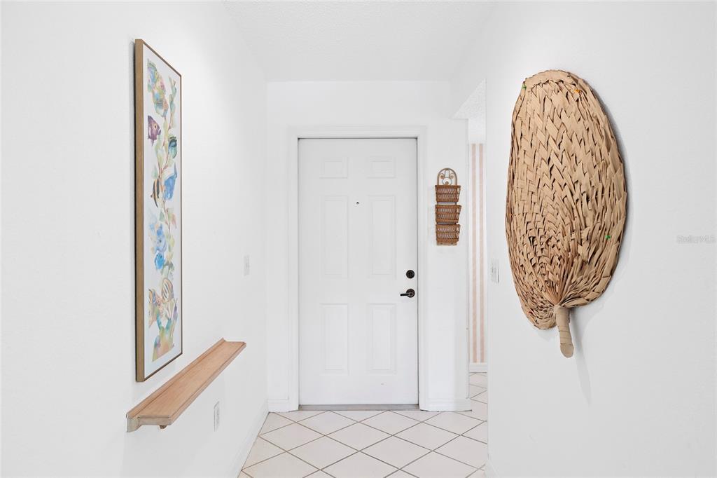 6507 Stone River Road, Unit 304 Bradenton, FL 34203 - Photo 6 of 51 a view of a hallway with windows