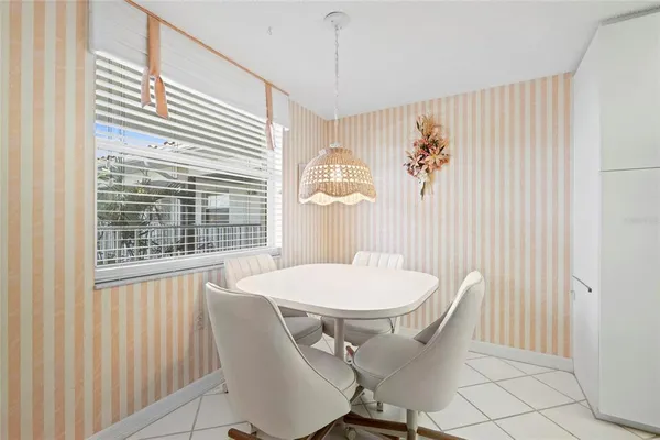 a view of a dining room with furniture window and outside view