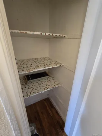 a view of a room with wooden floor and staircase