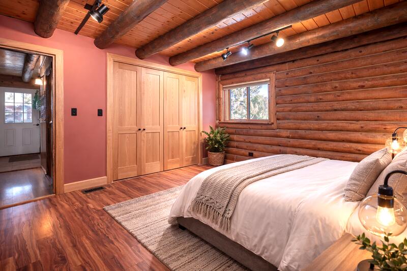 1391 North County Road Norwood, CO 81423 - Photo 17 of 34 a bedroom with a bed and wooden floor