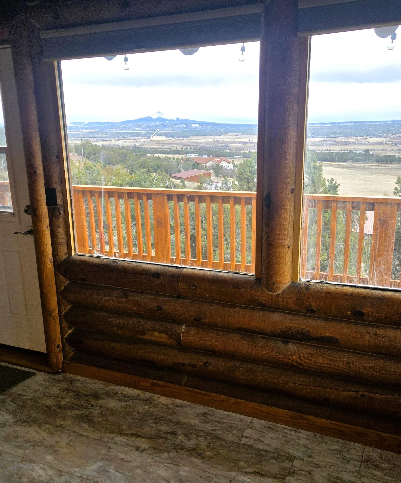 1391 North County Road Norwood, CO 81423 - Photo 26 of 34 a view of a room with wooden floor and windows
