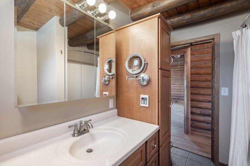 1391 North County Road Norwood, CO 81423 - Photo 8 of 34 a bathroom with a sink and a mirror