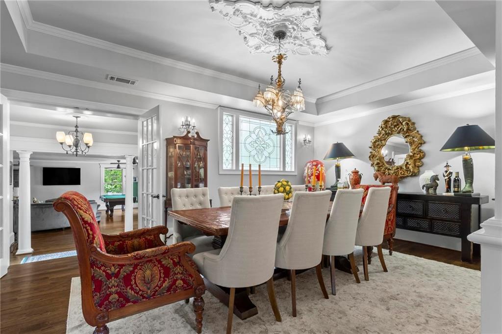 285 Old Hornage Road Ball Ground, GA 30107 - Photo 25 of 76 a view of a dining room with furniture a chandelier and wooden floor