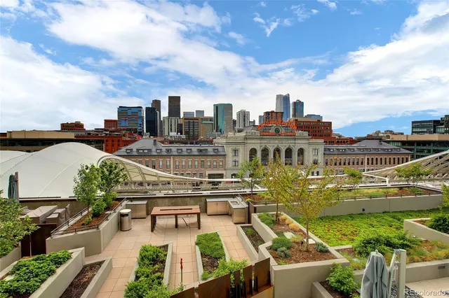 a view of a city with lawn chairs