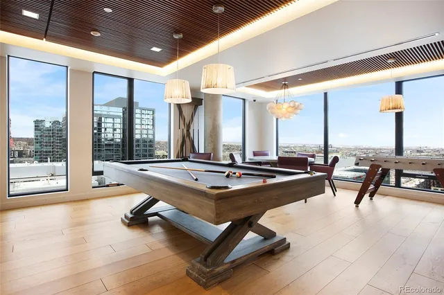 a room with gym equipment and large window