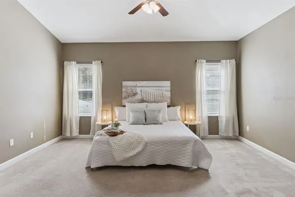 a bedroom with a bed and window