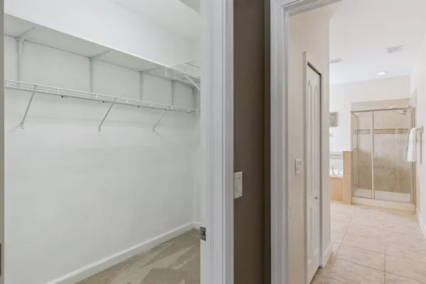 a bathroom with a granite countertop sink a large mirror and a bathtub