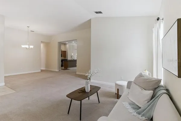 a living room with furniture and a window