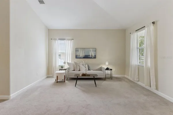 a living room with furniture and a window