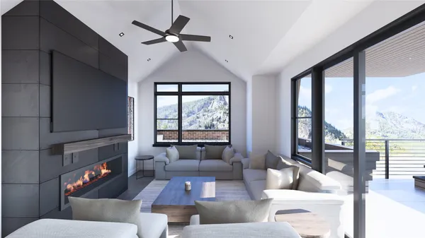 a living room with furniture and a fireplace