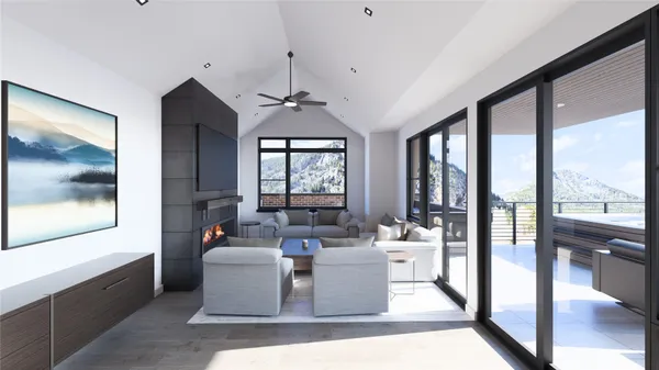 a living room with furniture and large windows