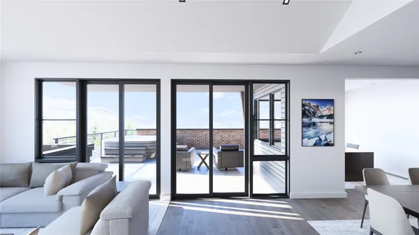a living room with furniture and a floor to ceiling window
