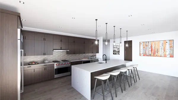 a kitchen with a stove a sink and a refrigerator