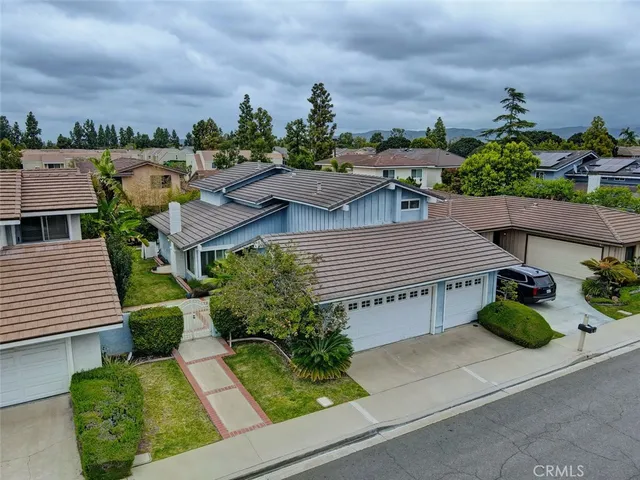 an aerial view of a house with a garden