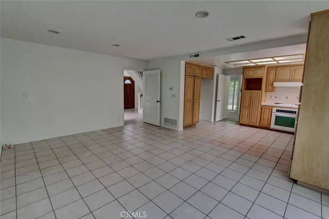 a view of a house with backyard and porch