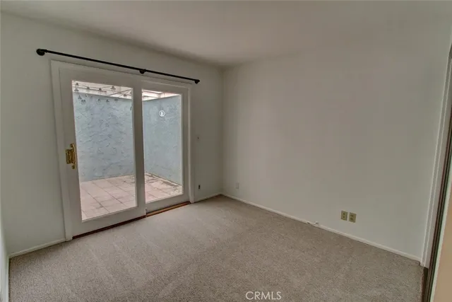 a bathroom with a granite countertop toilet and a shower