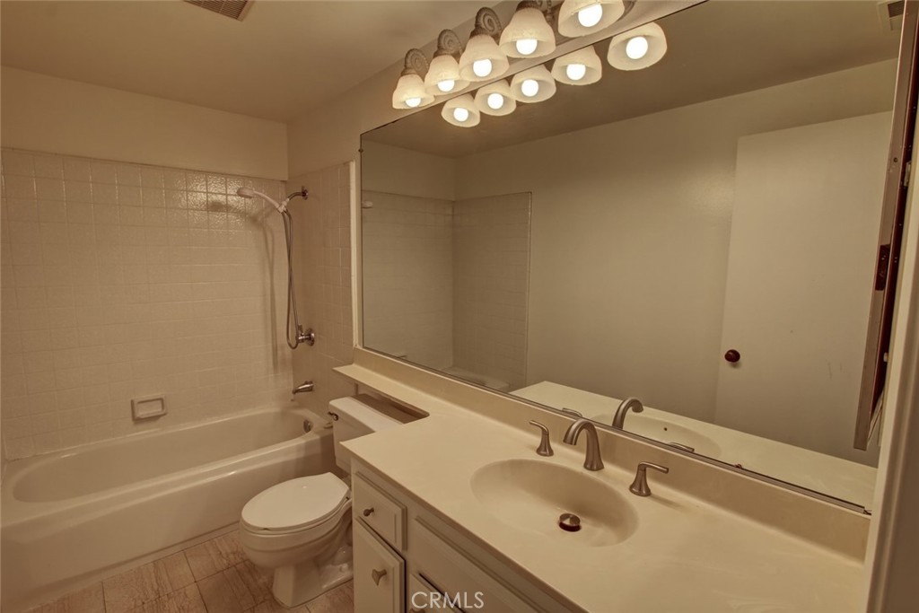 8 Sparrowhawk Irvine, CA 92604 - Photo 39 of 59 a bathroom with a sink mirror toilet and bathtub