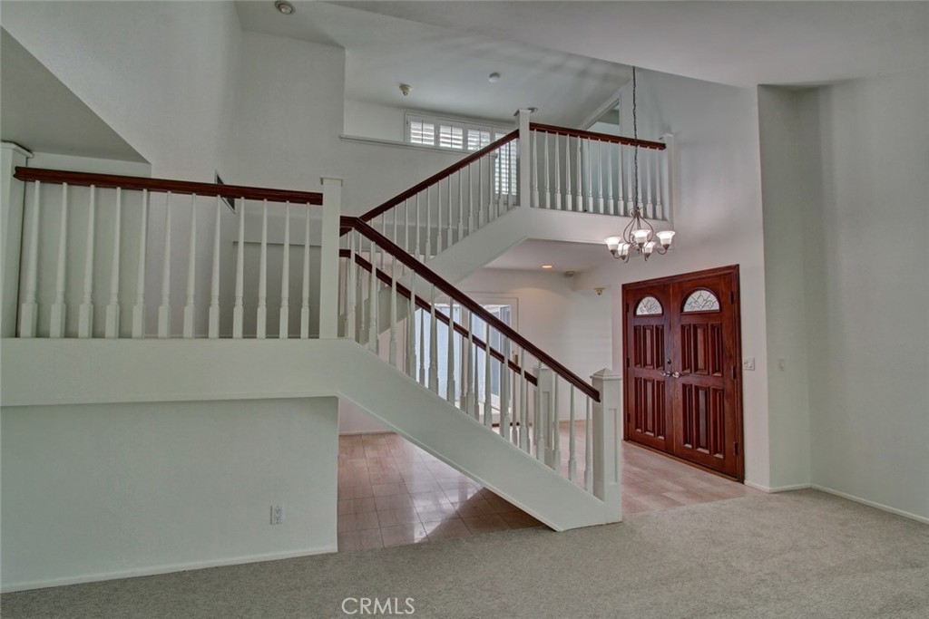 8 Sparrowhawk Irvine, CA 92604 - Photo 40 of 59 a view of staircase with lots of frames on wall and a window