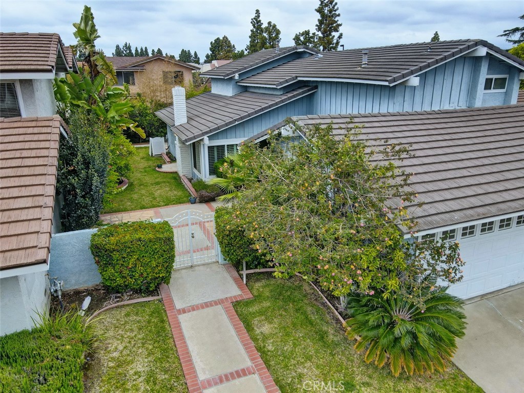 8 Sparrowhawk Irvine, CA 92604 - Photo 4 of 59 an aerial view of a house with a yard and potted plants