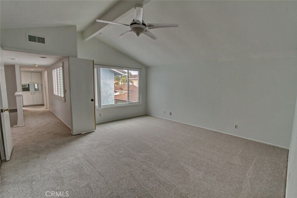 8 Sparrowhawk Irvine, CA 92604 - Photo 42 of 59 an empty room with windows and ceiling fan
