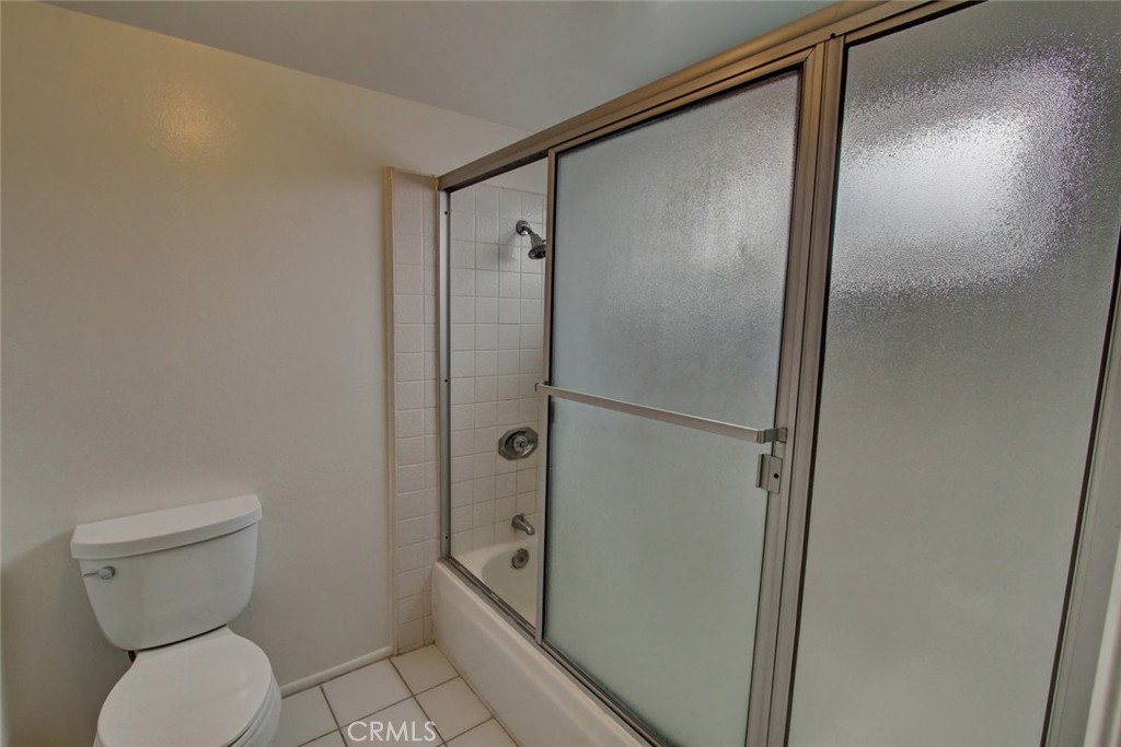 8 Sparrowhawk Irvine, CA 92604 - Photo 45 of 59 a bathroom with a granite countertop toilet and a shower