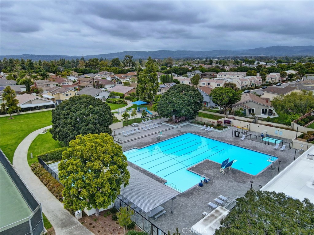 8 Sparrowhawk Irvine, CA 92604 - Photo 55 of 59 a view of a swimming pool with a patio and a yard