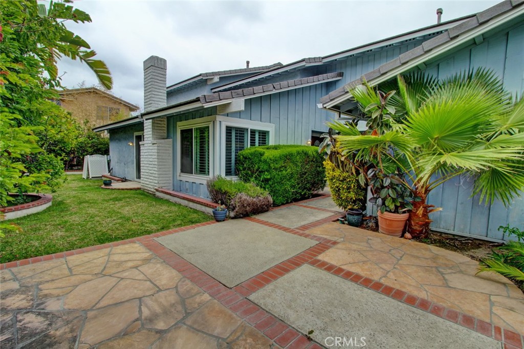 8 Sparrowhawk Irvine, CA 92604 - Photo 10 of 59 a view of a house with a yard and plants