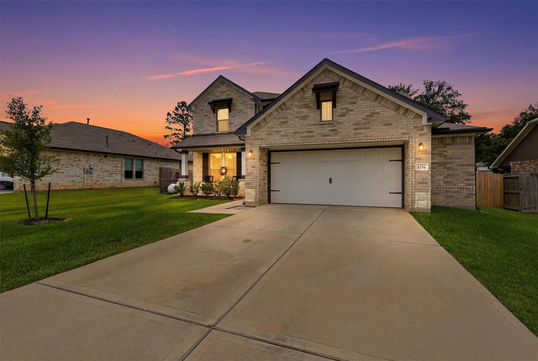 6310 Fawn Path Drive Conroe, TX 77303 - Photo 1 of 41 Exceptional curb appeal! Beautiful brick-and-stone exterior featuring an oversized driveway, spacious garage, charming front porch, and a generous .32-acre homesite.
