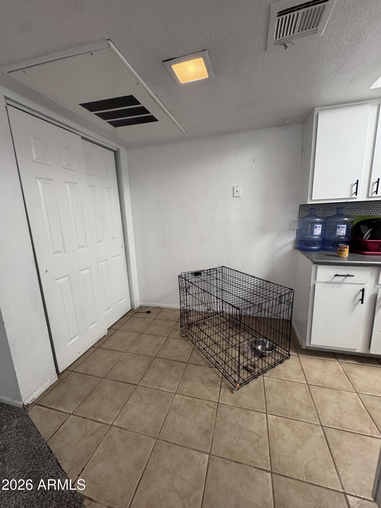 1336 East Mountain View Road, Unit 201 Phoenix, AZ 85020 - Photo 13 of 16 a living room with a washing machine and a sink