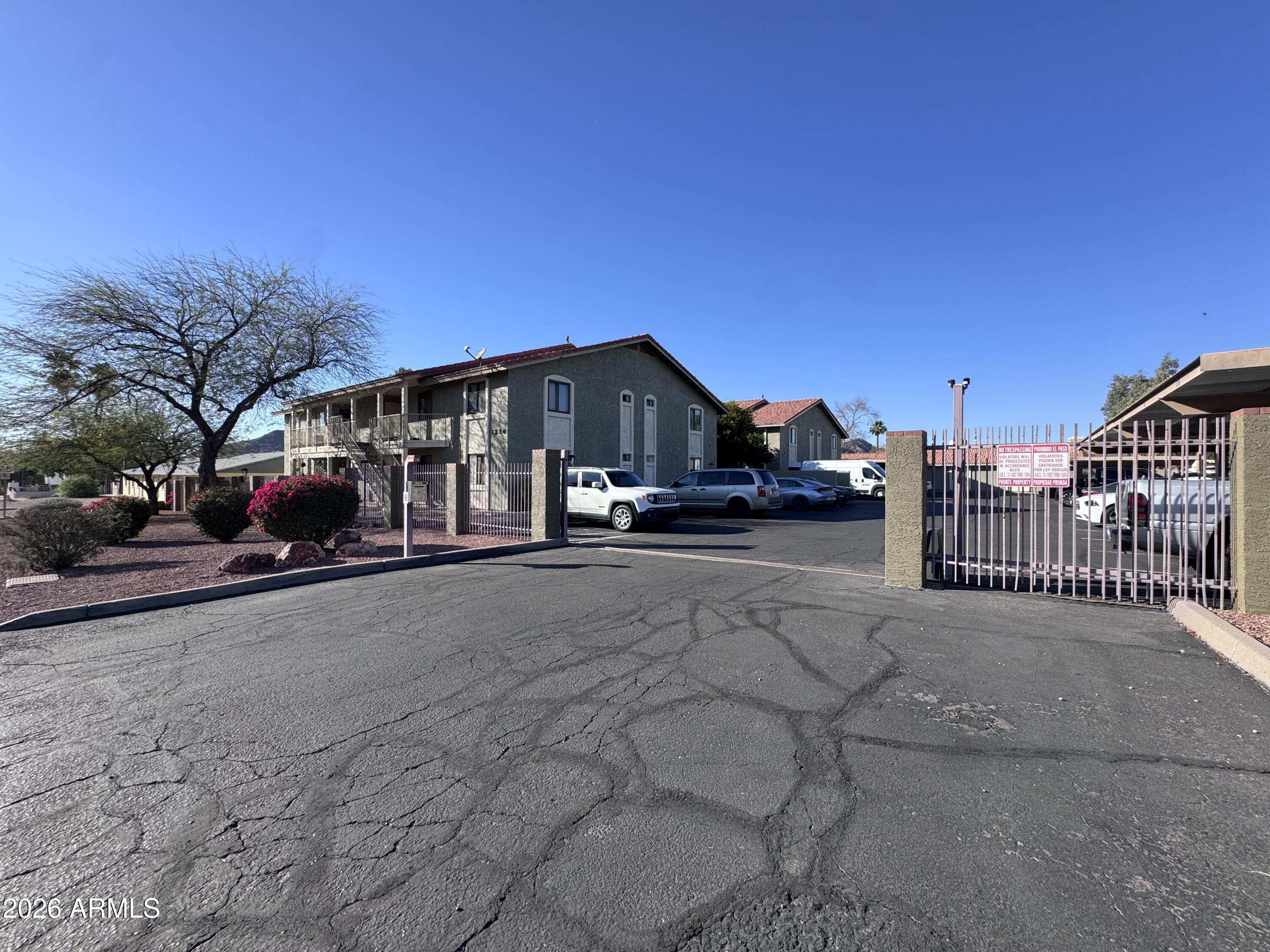 1336 East Mountain View Road, Unit 201 Phoenix, AZ 85020 - Photo 2 of 16 a view of street along with parked cars